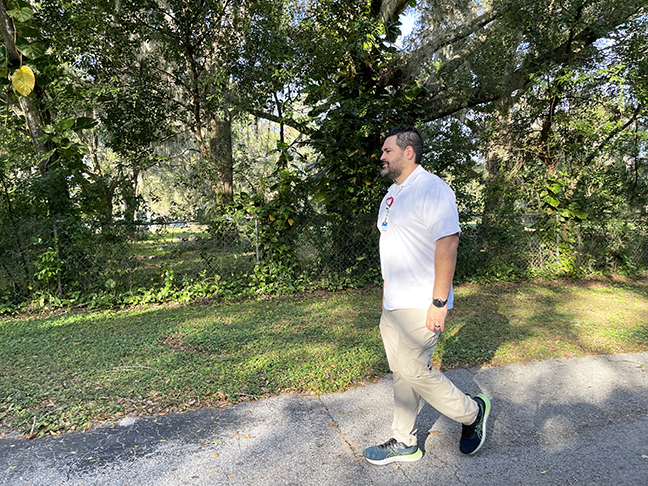 Kenny Torres Cruz walking outdoors
