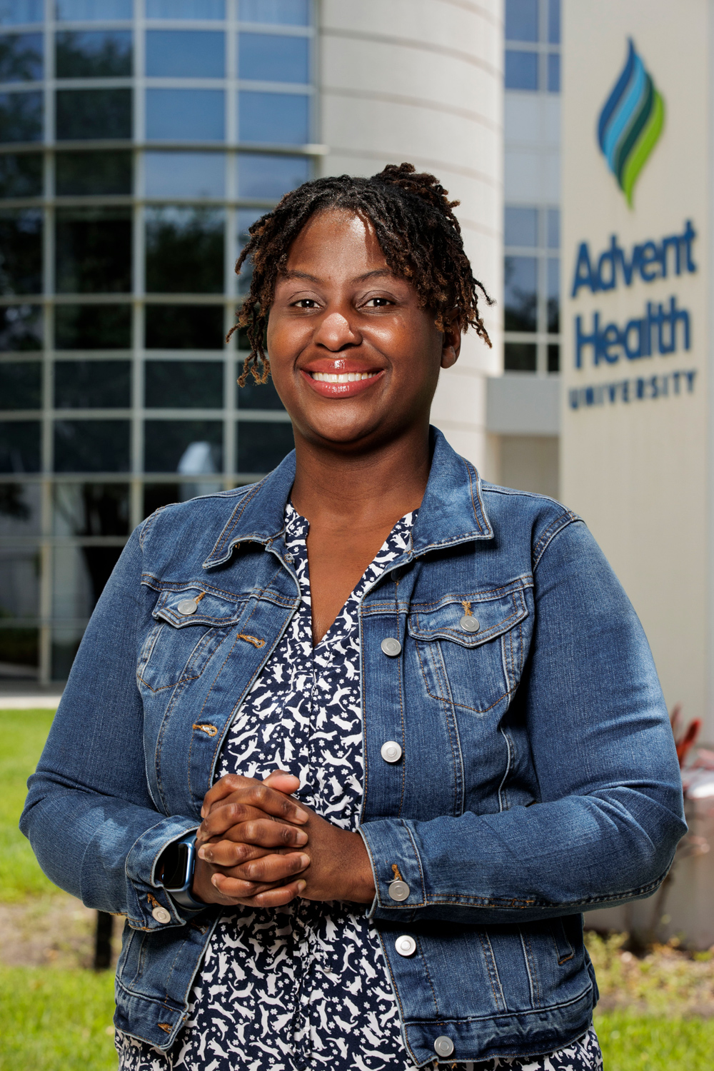 Khandi Stewart-Cooper standing outside the Campus Center building at AHU