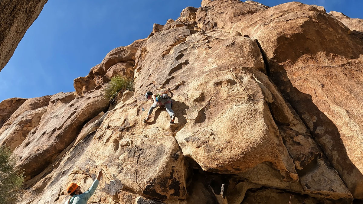 Woman climbing mountain
