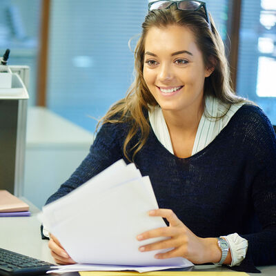 A student meeting with a university staff member in an office