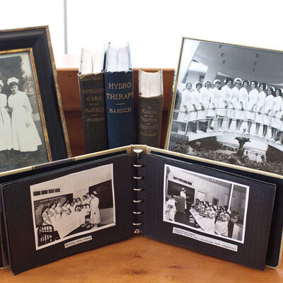Frames and photo albums containing pictures from Florida Hospital School of Nursing