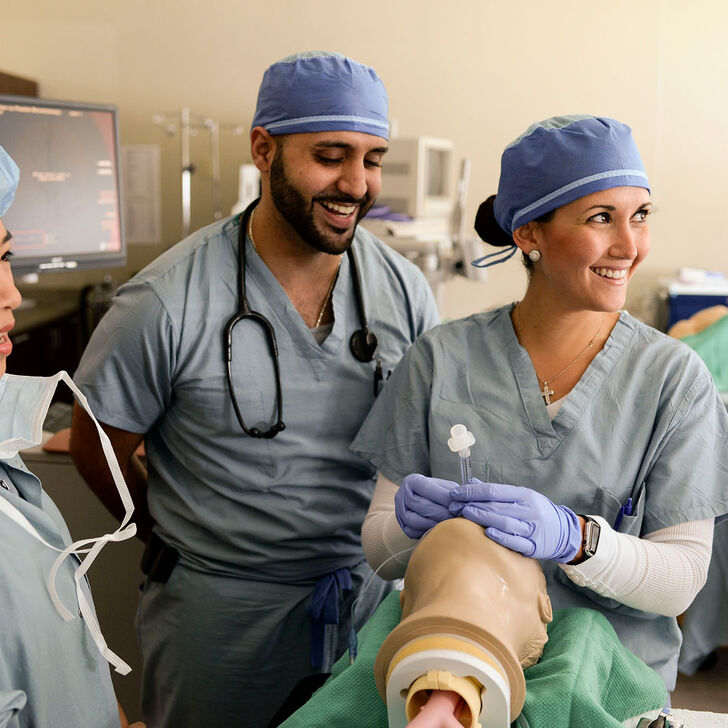 Nurse anesthesia students practicing intubation procedures in the skills lab